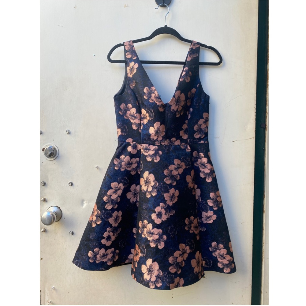 Betsey Johnson flower party dress with deep v and pockets. Metallic shine